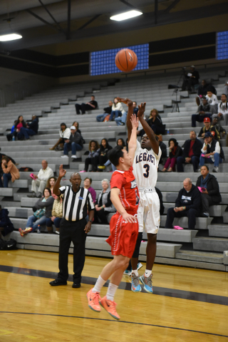 Legacy’s Dontre Avery (3) shoots the ball over La Salle’s Justin Jitpatima (5) o ...