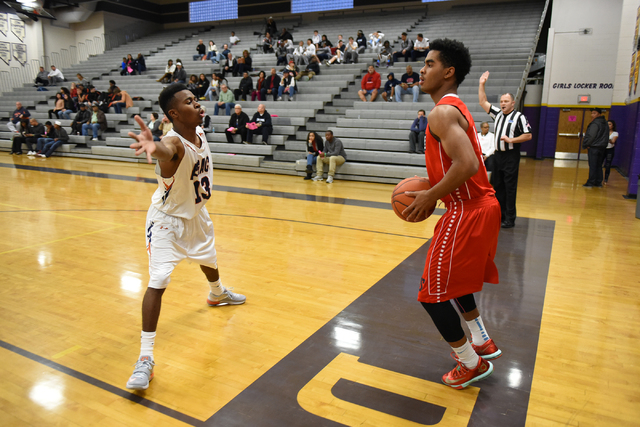 LaSalle’s Javan Burnom (1), right, attempts an inbounds pass against Legacy’s Ja ...