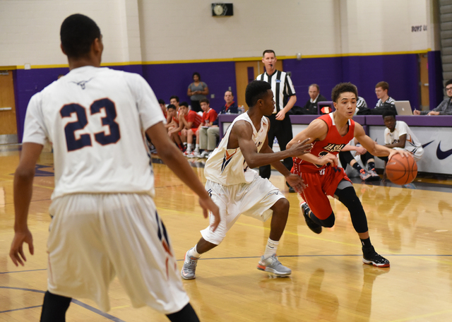 LaSalle’s Johnny Knox (23) drives against Legacy’s Jacob Rainey (13) on Saturday ...