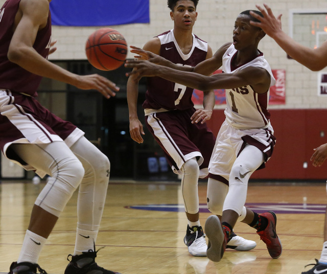 Agassi Najeeb Muhammad (1) makes a quick pass during a boys basketball game on Wednesday, Ja ...