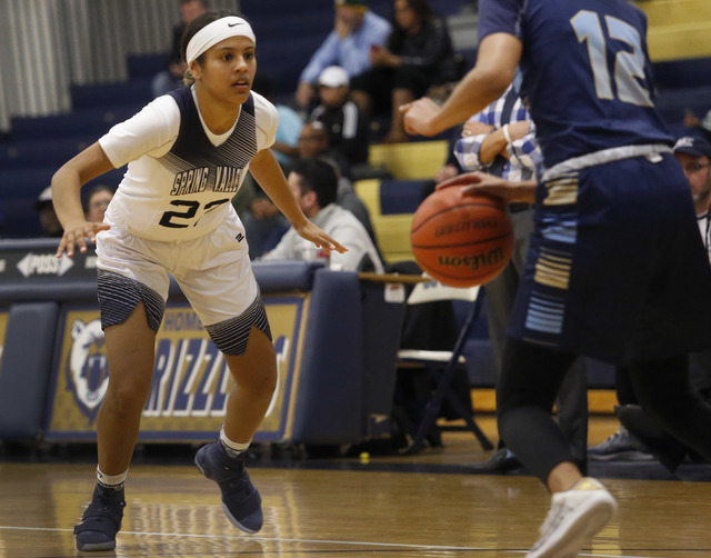 Spring Valley Alyssa Scott (23) stares down Foothill Rae Burrell (12) while playing defense ...