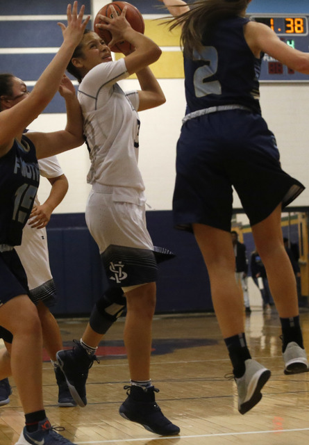 Spring Valley’s Essence Booker (3) shoots a layup during a basketball game at Spring V ...