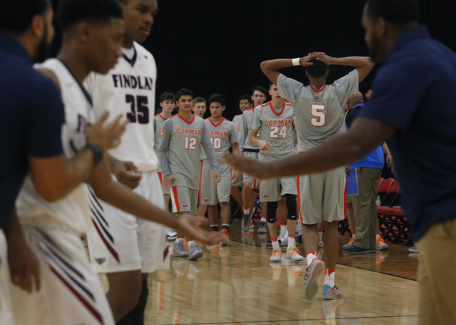 Bishop Gorman’s Chuck O’Bannon (5) reacts as a Findlay Prep’s coach slaps ...