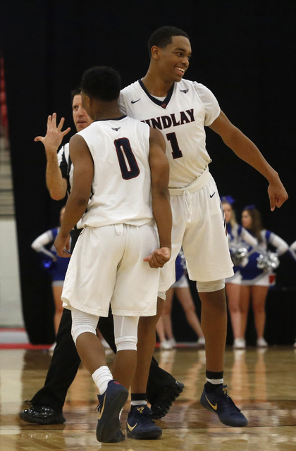 Findlay Prep’s P.J. Washington (1) celebrates early with Findlay Prep’s Justin R ...