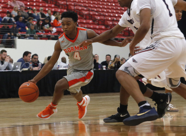 Bishop Gorman’s D.J. Howe (4) drives towards the hoop during a high school basketball ...