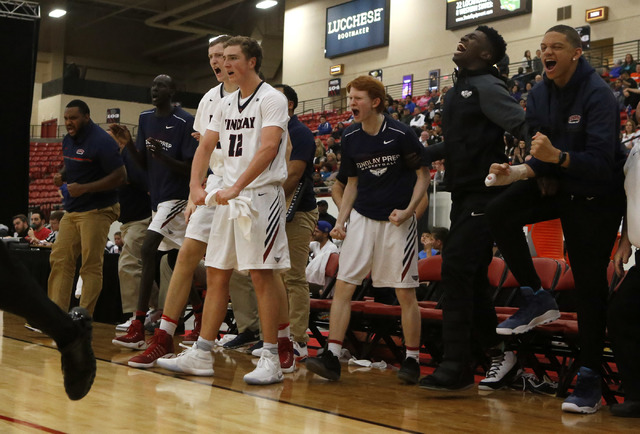 Findlay Prep players cheer during a high school basketball game at the South Point Arena on ...