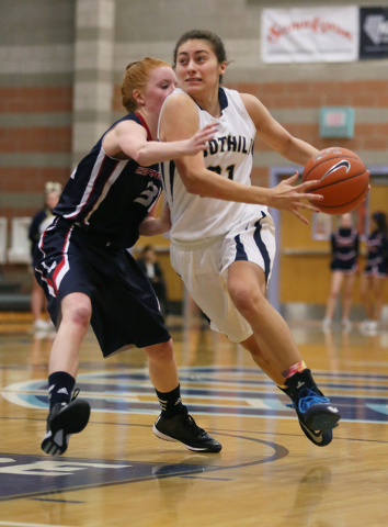 Foothill’s Taylor Turney, right, drives past Coronado’s Karlie Thorn on Thursday ...