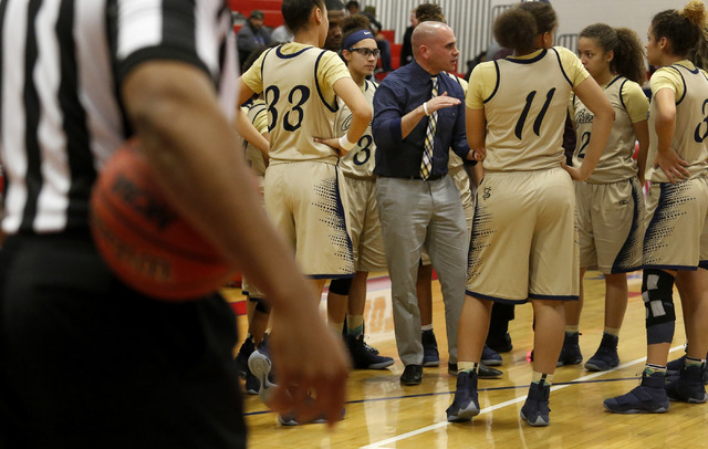 Spring Valley’s head coach Billy Hemberger speaks to the team during a girls basketbal ...