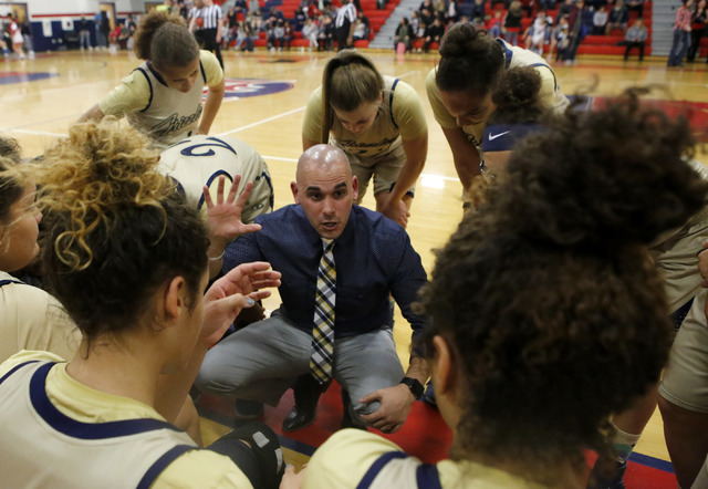 Spring Valley’s head coach Billy Hemberger speaks to the team during a girls basketbal ...