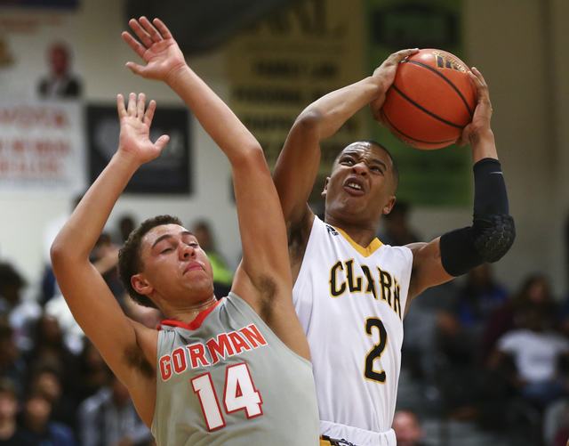 Clark’s Sedrick Hammond (2) gets to the basket over Bishop Gorman’s Saxton Howar ...