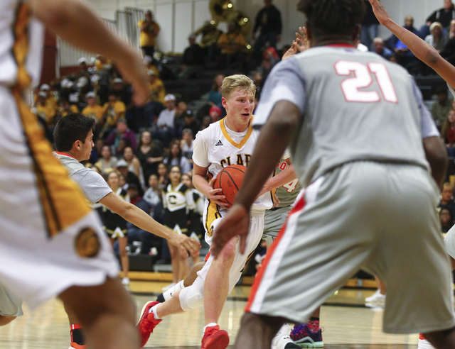 Clark’s Trey Woodbury (22) drives against Bishop Gorman during a basketball game at Cl ...