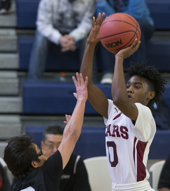 Agassi Prep’s Akeemis Williams (0) takes a shot against Mountain View in the boy&#8217 ...