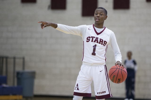 Agassi Prep’s Najeeb Muhammad (1) gestures his team in their boy’s basketball ga ...