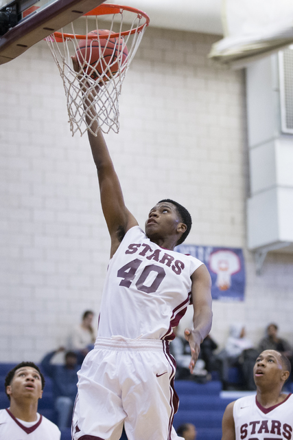 Agassi Prep’s Miles Mixon (40) goes up for a layup against Mountain View in the boy&#8 ...