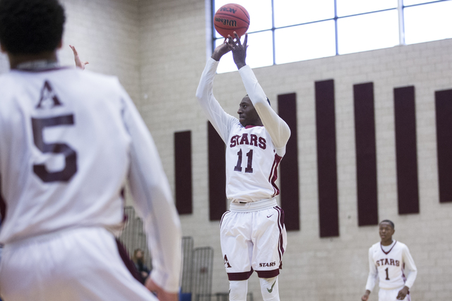 Agassi Prep’s Jared Holmes (11) goes up for a shot against Mountain View in the boy&#8 ...