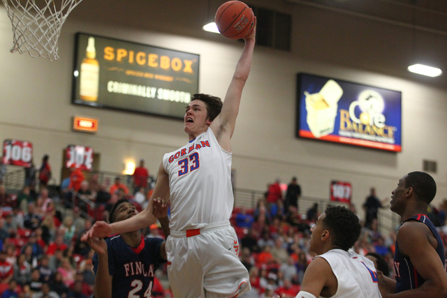 Bishop Gorman’s Stephen Zimmerman (33) goes for a dunk over Findlay Prep’s Craig ...