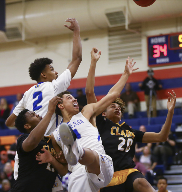 Clark forwards Antwon Jackson (23) Jalen Hill (20) fight for a rebound against Bishop Gorman ...