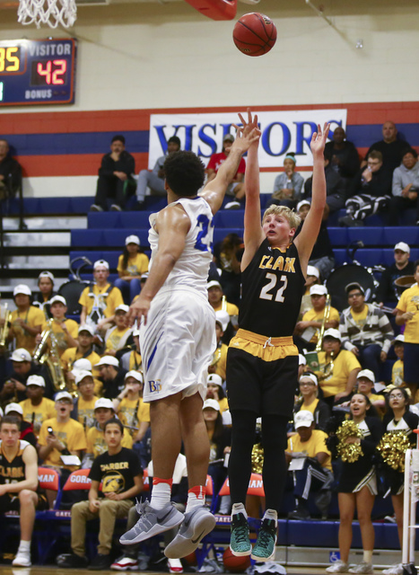 Clark guard Trey Woodbury (22) shoots over Bishop Gorman forward Ryan Kiley (23) during a ba ...