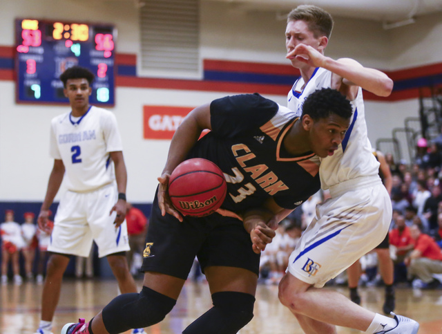 Clark forward Antwon Jackson (23) drives against Bishop Gorman guard Noah Taitz (20) during ...