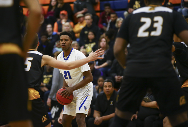 Bishop Gorman guard Christian Popoola (21) looks for an open pass during a basketball game a ...