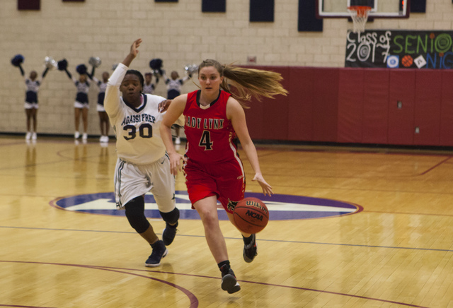 Lincoln County’s Sadie Soderborgat (4) drives past Agassi Prep guard Sharmayne Finley ...