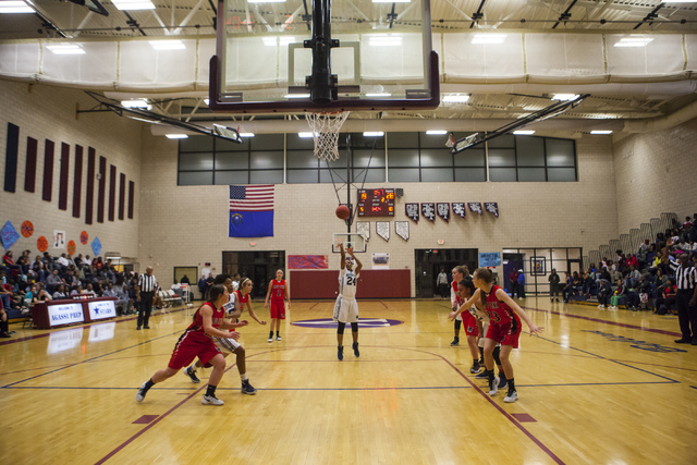 Agassi Prep guard Destiny Rover (24) shoots during a game against Lincoln County at Andre Ag ...