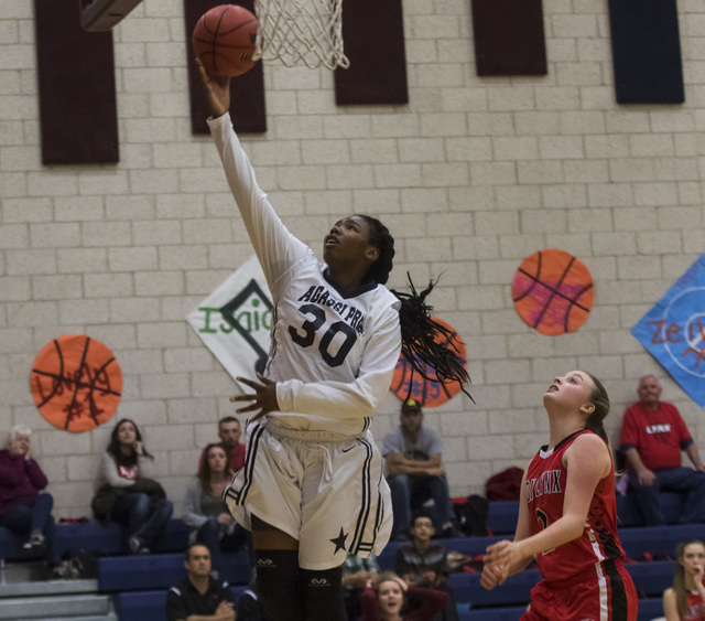 Agassi Prep guard Sharmayne Finley (30) shoots the ball during a game against Lincoln County ...