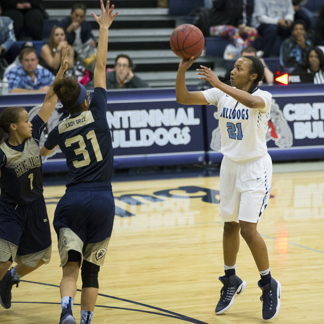 Centennial’s Justice Ethridge (21) takes a shot against Spring Valley in the girls bas ...