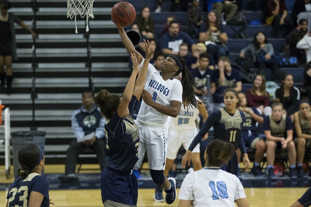 Centennial’s Pam Wilmore (1) takes a shot against Spring Valley in the girls basketbal ...