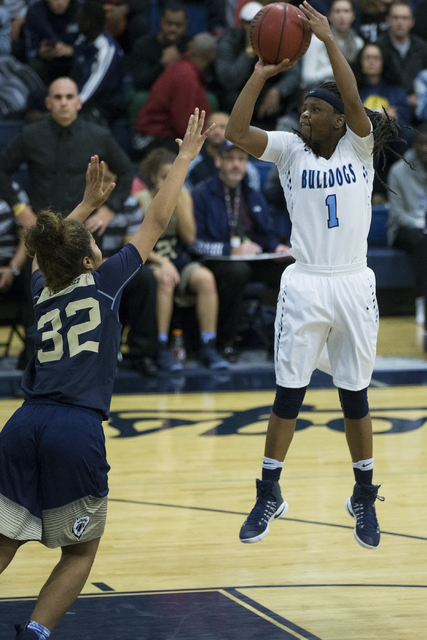 Centennial’s Pam Wilmore (1) takes a shot against Spring Valley in the girls basketbal ...