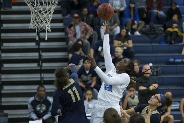 Centennial’s Eboni Walker (22) takes a shot against Spring Valley in the girls basketb ...