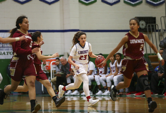 Liberty’s Alexis Tomassi (23) drives the ball against Downey during the Gator Winter C ...