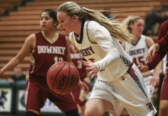 Liberty’s London Pavlica (5) drives against Downey during the Gator Winter Classic cha ...