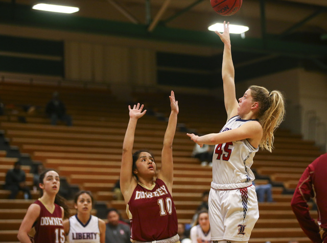 Liberty’s Amanda Pemberton (45) goes up for a shot against Downey during the Gator Win ...