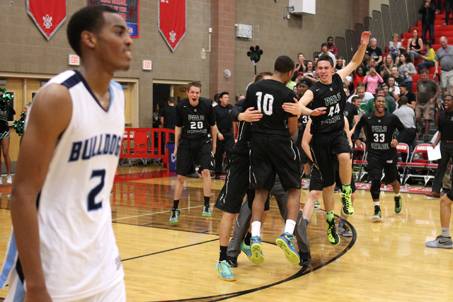 Palo Verde players celebrate after defeating Centennial 75-72 in the Sunset Region semifinal ...