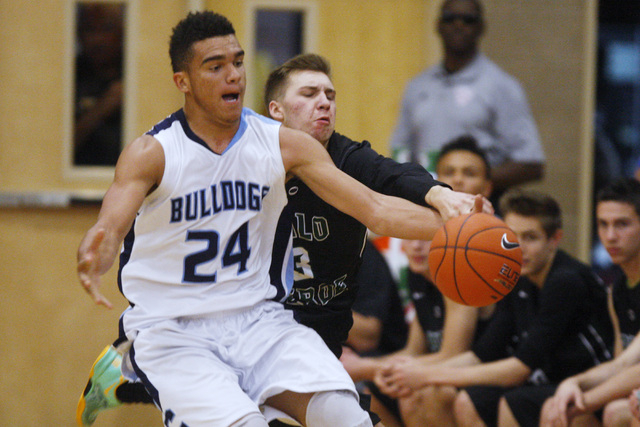 Palo Verde guard Furious Fernandes tries to steal the ball from Centennial guard Darrian Tra ...