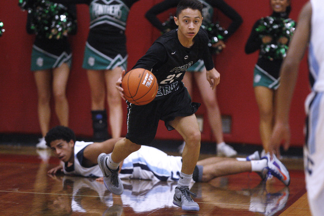 Palo Verde guard Taylor Miller grabs a loose ball and dribbles up the court against Centenni ...