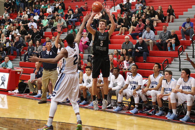 Palo Verde forward Grant Dressler takes a 3-point shot over Centennial guard Troy Brown duri ...