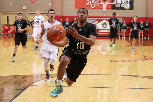 Palo Verde guard Ja Morgan drives to the basket against Centennial during their Sunset Regio ...