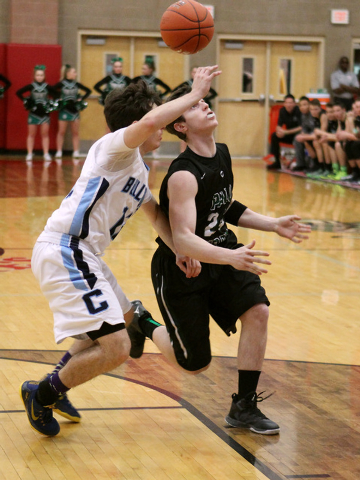 Palo Verde guard Ryan Vogelei loses control of the ball while being defended by Centennial g ...