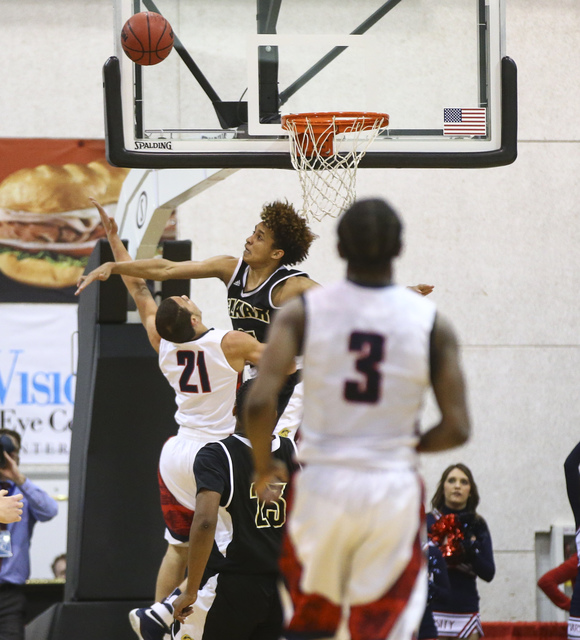 Clark forward Jalen Hill (21) blocks a shot from Coronado’s Freddy Reeves (21) during ...