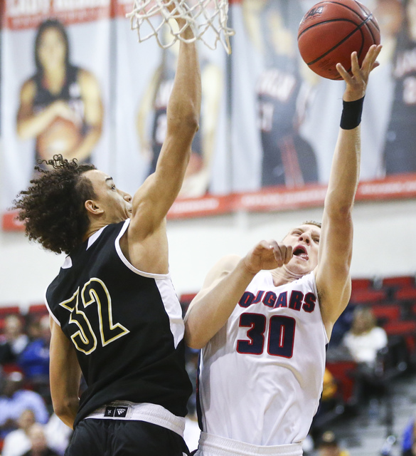 Coronado’s Kennedy Koehler (30) shoots against Clark forward Ian Alexander (32) during ...