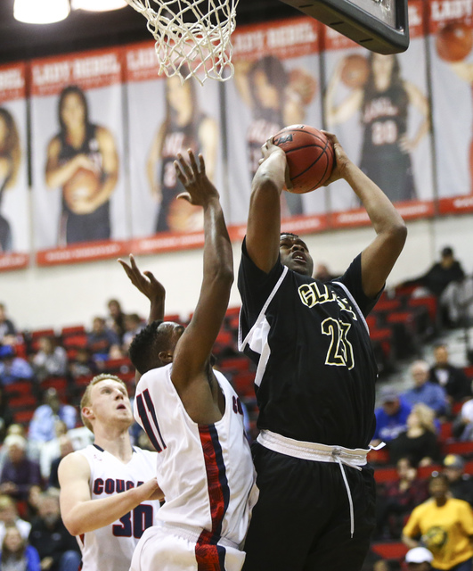 Clark forward Antwon Jackson (23) gets a rebound over Coronado during the Class 4A boys stat ...