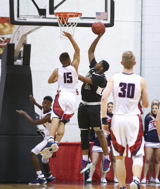 Clark guard James Bridges (15) shoots against Coronado’s Bryce Savoy (15) during the C ...