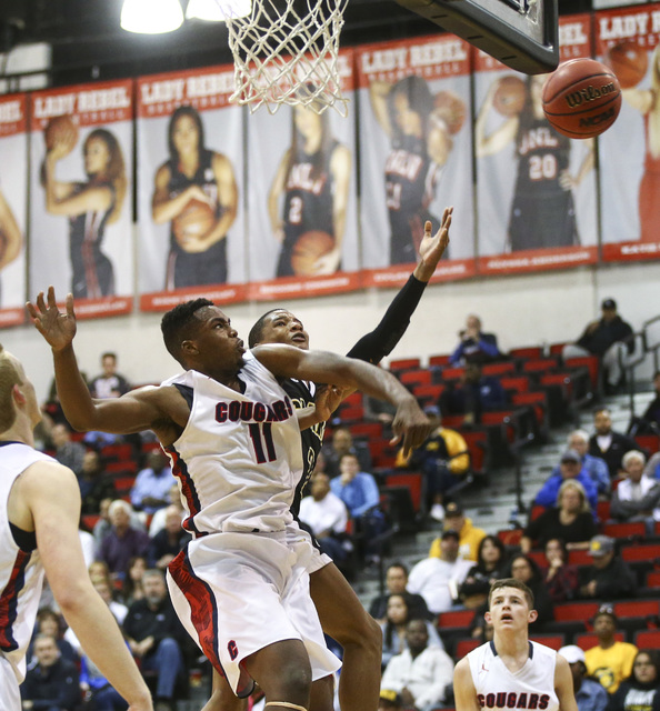 Coronado’s Will Weems (11) blocks a shot from Clark guard Sedrick Hammond (2) during t ...