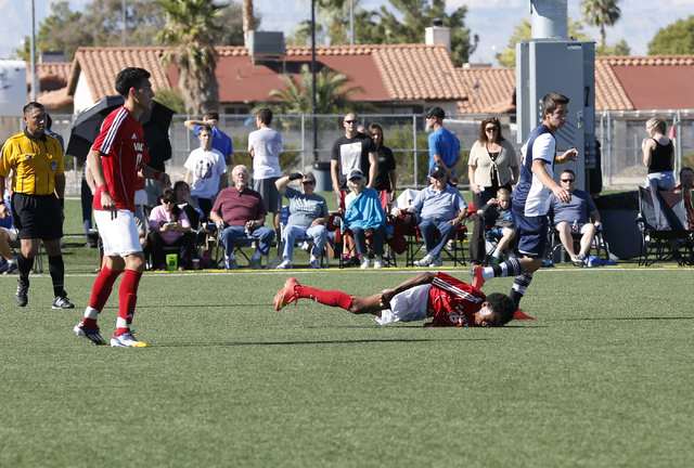 Valley’s Abel Tesfa (16) hits the ground hard after colliding with Foothill’s Aa ...