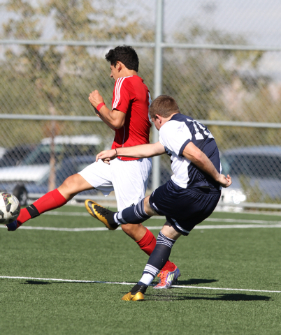 Foothill’s Michael Carnahan (10) kicks the ball while Valley’s Luis Meza (4) str ...