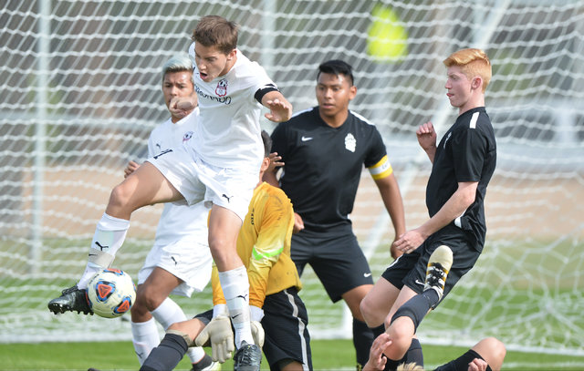 Coronado’s Mathew Laudenslager (21) takes a heel shot toward the goal during the boys ...