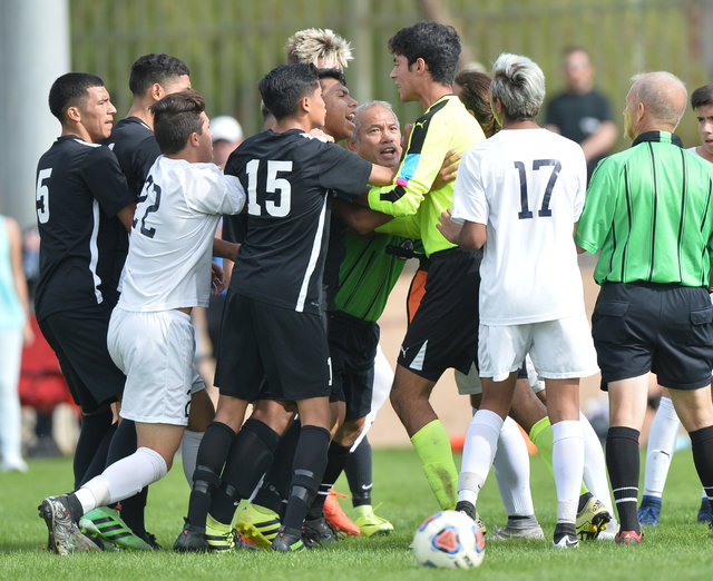 Players from Coronado High School and Galena High School get into a shoving match during the ...