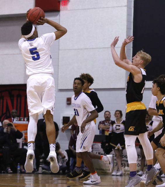 Bishop Gorman’s Chuck O’Bannon (5) shoots over Clark’s Trey Woodbury (22) ...